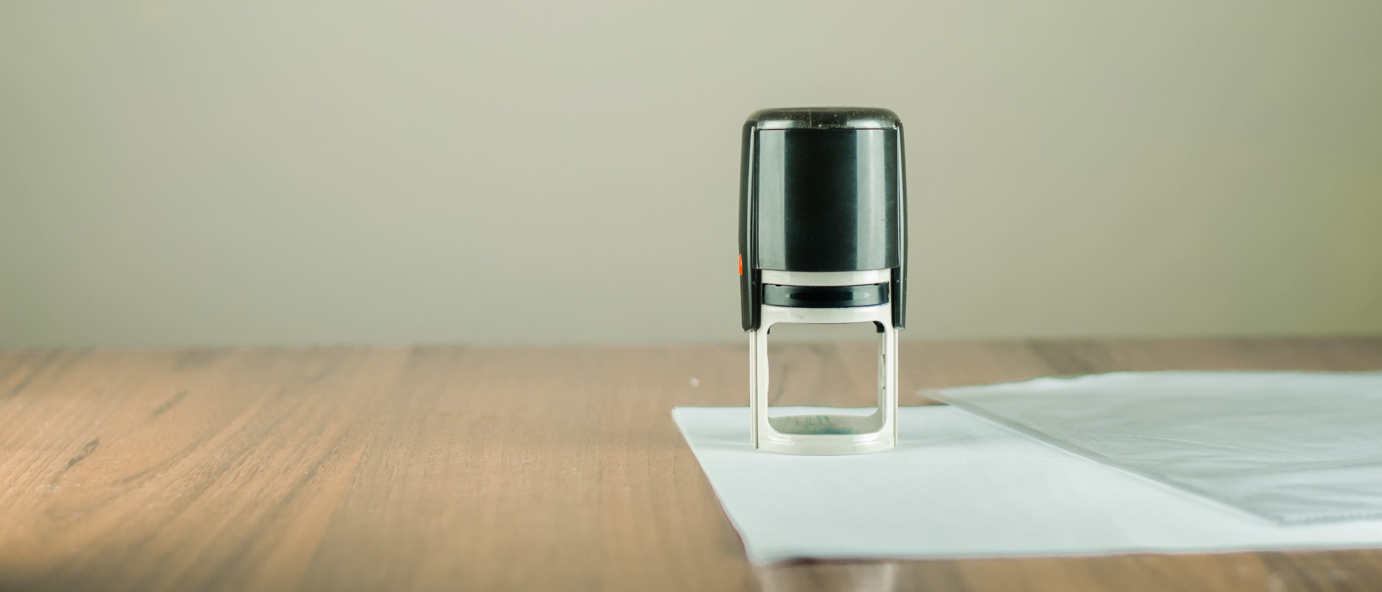 Notary stamp with papers on a desk